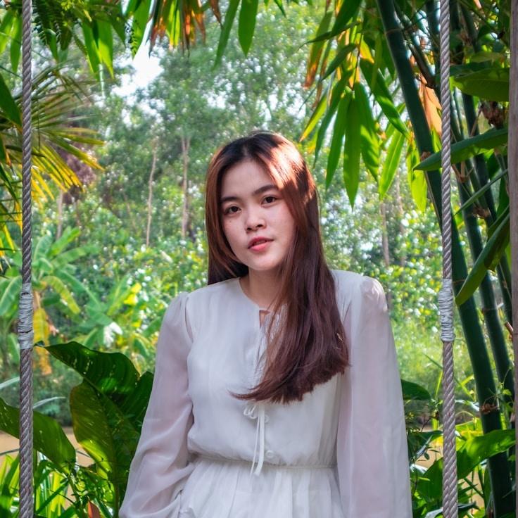 Kaveri Mehta, Lead Design Curator at Mingle Language Mosaic, reviewing corporate floral arrangements